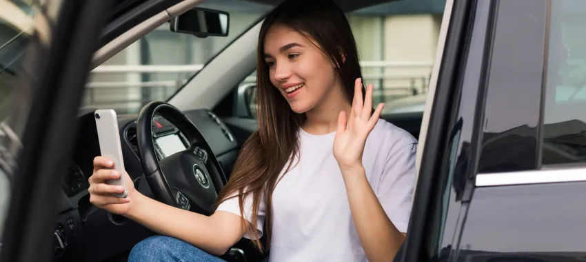 Woman sitting in her car 