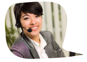 A woman wearing a headset and a business suit is smiling into the camera