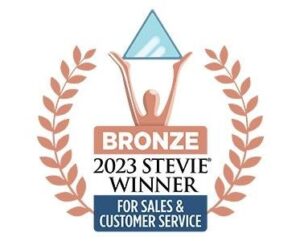 Bronze trophy holding up a triangle symbol, surrounded by bronze fig leaves. "Bronze 2023 Stevie Winner for Sales & Customer Service"